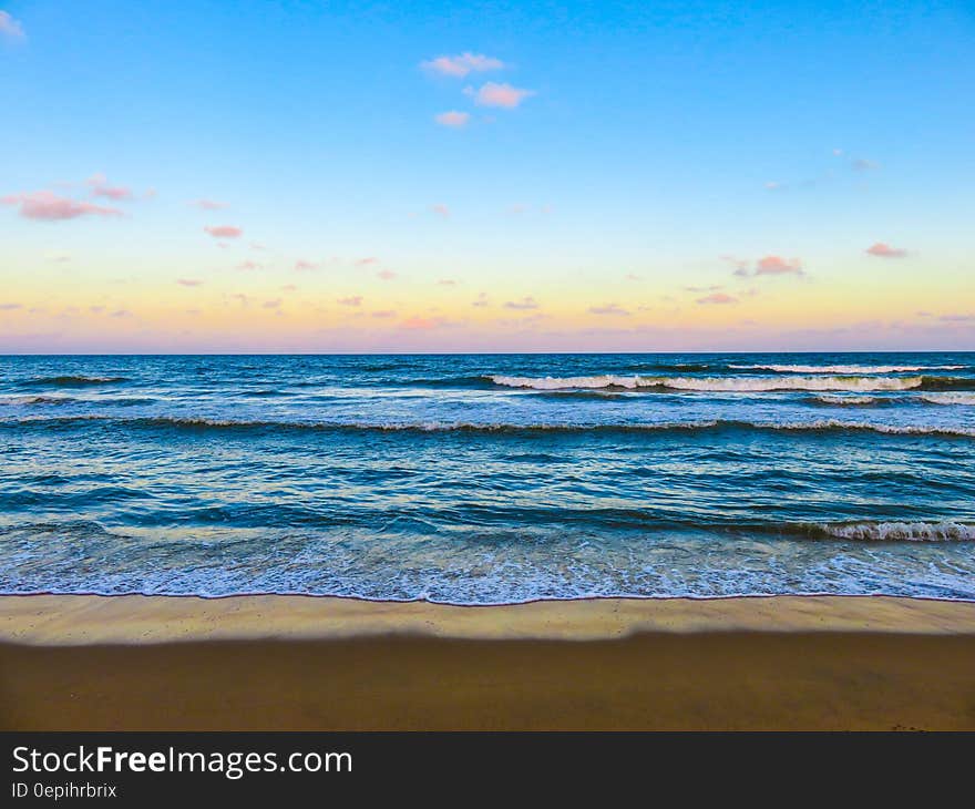 Seashore With Sea Waves during Daytime