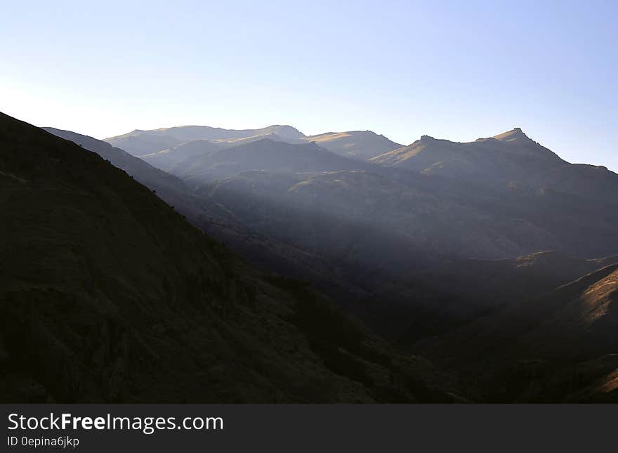 Mountain landscape against blue skies on sunny day. Mountain landscape against blue skies on sunny day.