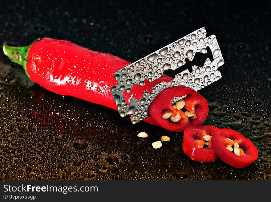 Red Chili Pepper Sliced by a Blade