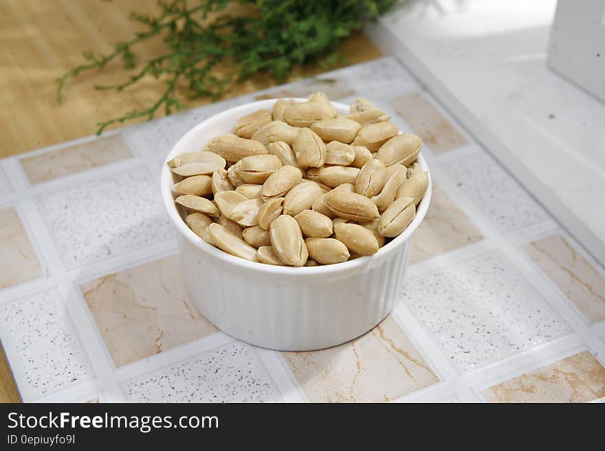 Peanuts in White Ceramic Bowl