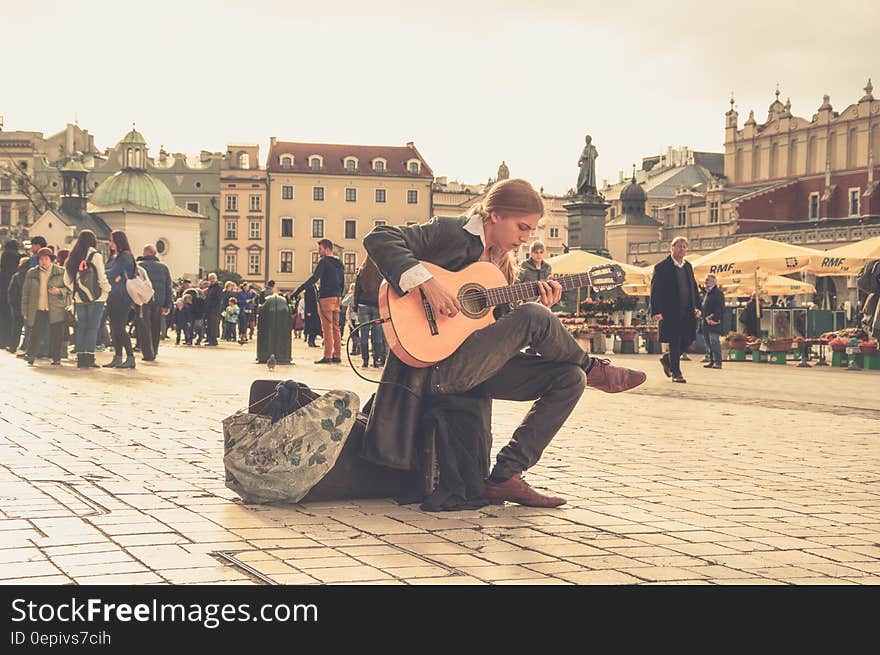 Man Playing Acoustic Guitar