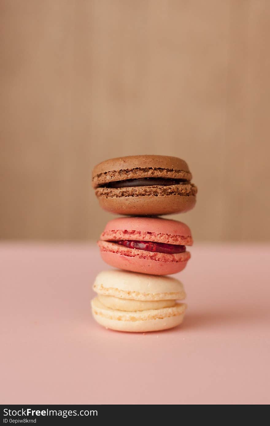 Stack of colorful filled French macaroons.