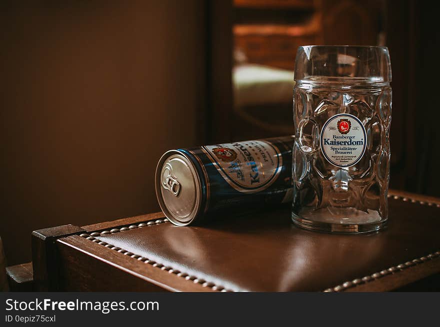 Kaiserdom beer stein and unopened can on wooden table. Kaiserdom beer stein and unopened can on wooden table.