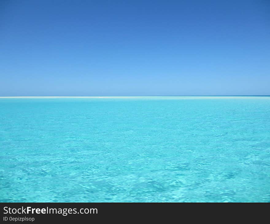 Blue and White Ocean during Day Time