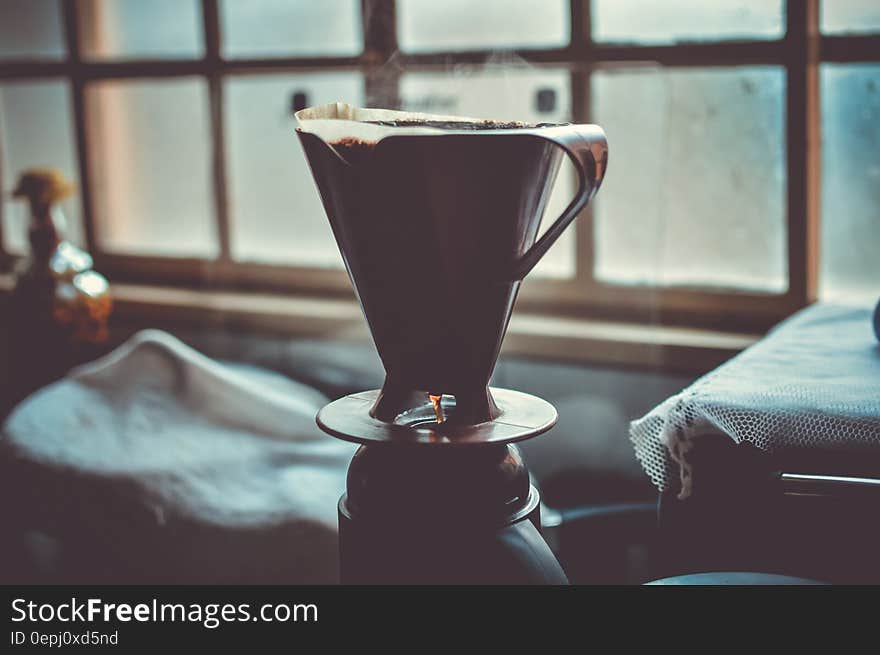 Black and Grey Ceramic Cup With Hot Coffee