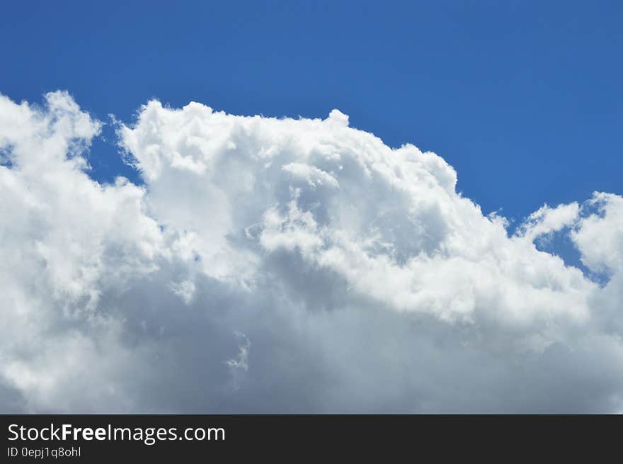 Blue skies with fluffy white clouds on sunny day. Blue skies with fluffy white clouds on sunny day.