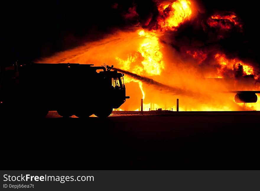 Firetruck Spraying Water on Fire