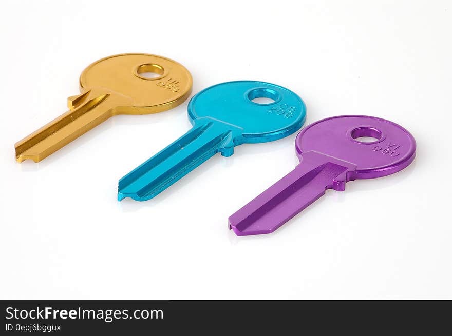 Three Keys in a White Background Photo