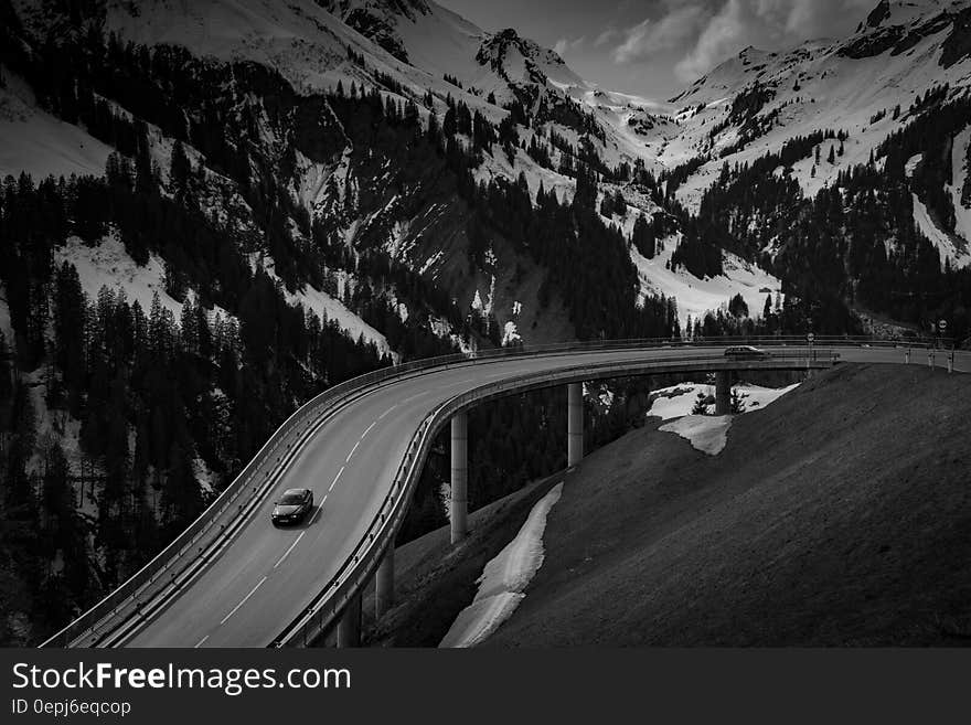 Grey Car on Road Near Snow Covered Mountain