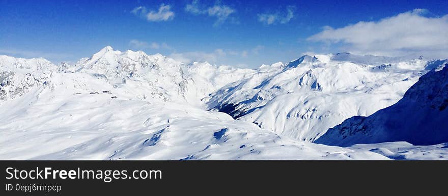 Snow Covered Mountain Under Blue Sky during Daytime