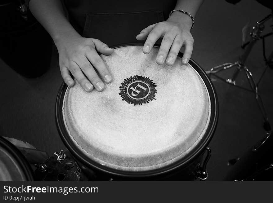 Person Holding Drums