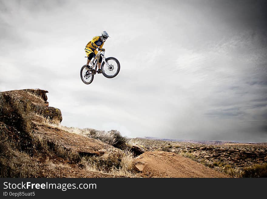 Person Riding Bike Making Trek on Thin Air