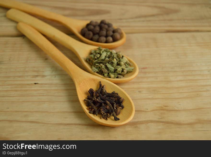 Vegetables and Beans on Brown Wooden Measuring Spoon