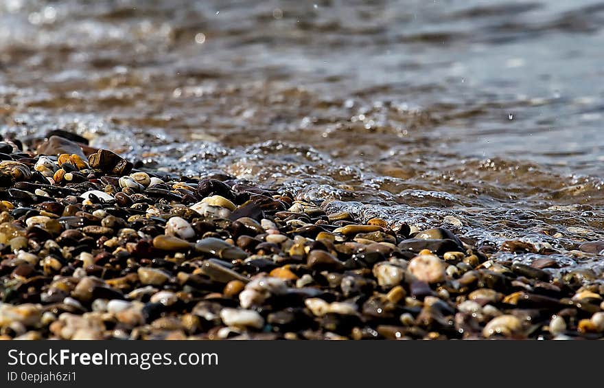 Stones Near the Beach Seashore during Day Time