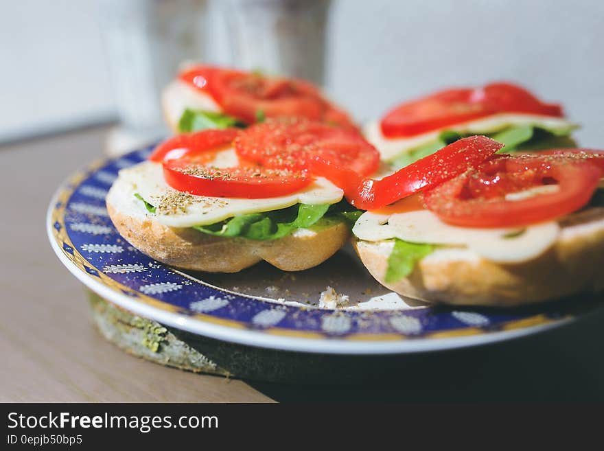 Sandwiches with cheese, lettuce and tomato on a plate