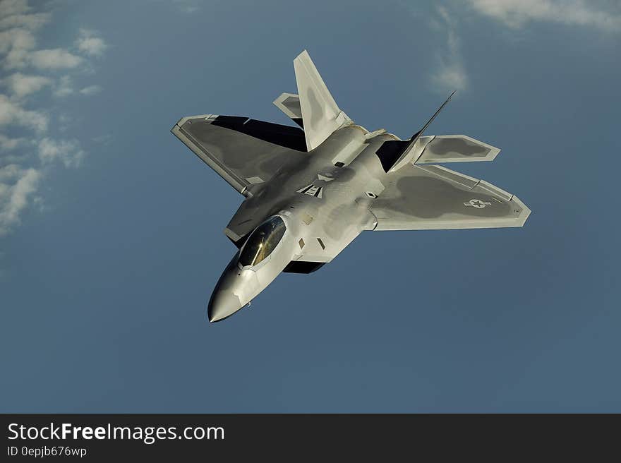 Gray Jet Flying Through the Sky during Daytime