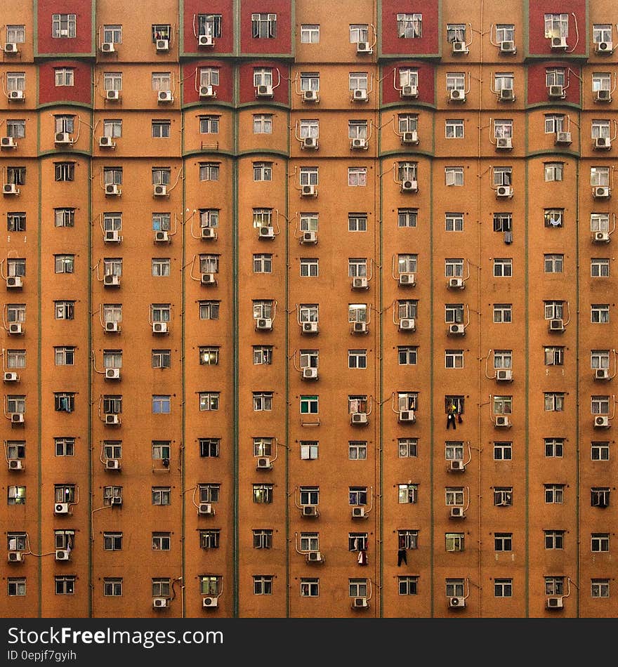 Brown Concrete Building With Aircon Every Room