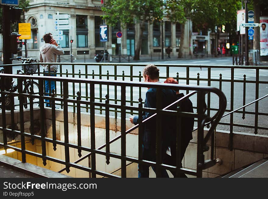 2 Person Walking on Stairs during Daytime