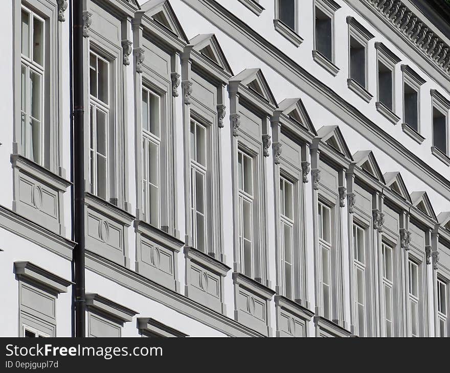 Windows on exterior of building in black and white. Windows on exterior of building in black and white.