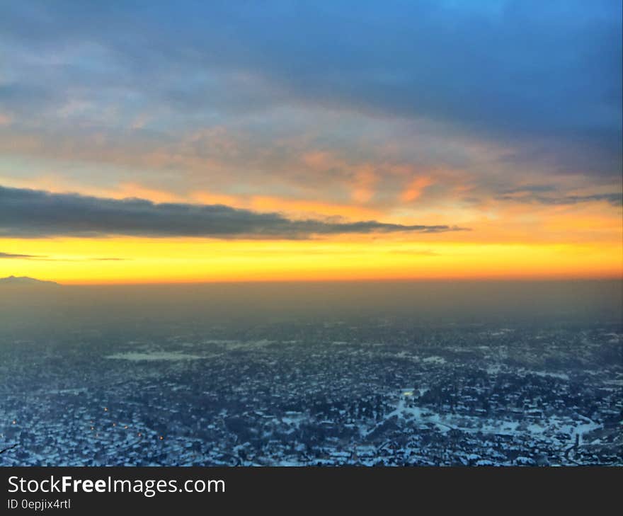 A sunset over a snowy valley. A sunset over a snowy valley.