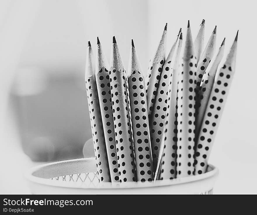 Grayscale Photography of Pencil Inside Round Basket