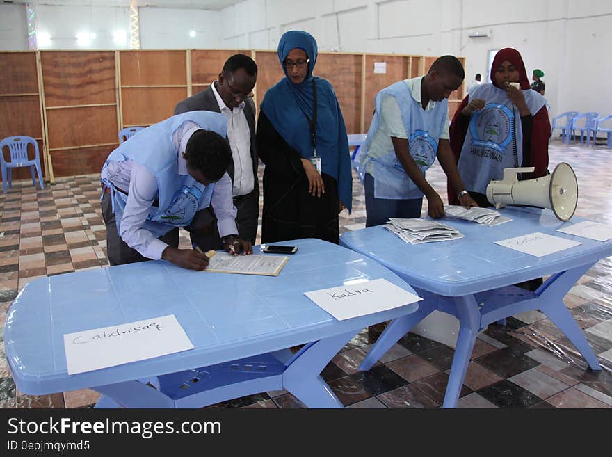 Electoral officials count and tally votes at a polling station during the electoral process for Somaliland and the northern regions held in Mogadishu on Thursday, December 22, 2016. AMISOM Photo/ Atulinda Allan. Electoral officials count and tally votes at a polling station during the electoral process for Somaliland and the northern regions held in Mogadishu on Thursday, December 22, 2016. AMISOM Photo/ Atulinda Allan