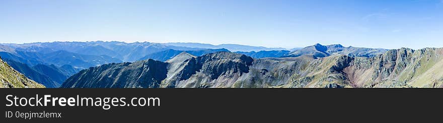 Green Mountain Under Blue Sky during Daytime