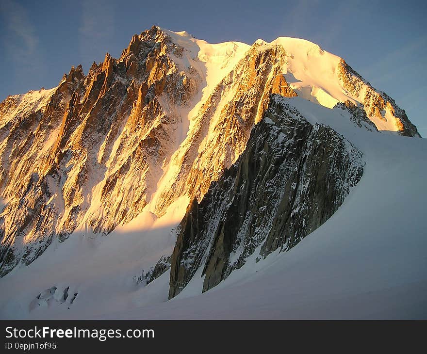 Grey Mountain Filled With Snow Under Grey Sky