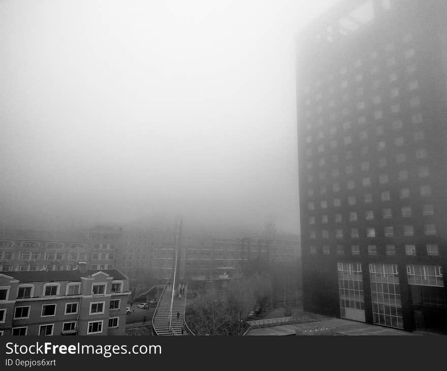 Fog around high rise modern building in black and white. Fog around high rise modern building in black and white.