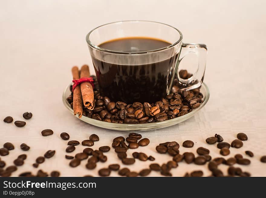 Clear Glass Coffee Cup on Clear Round Glass Saucer