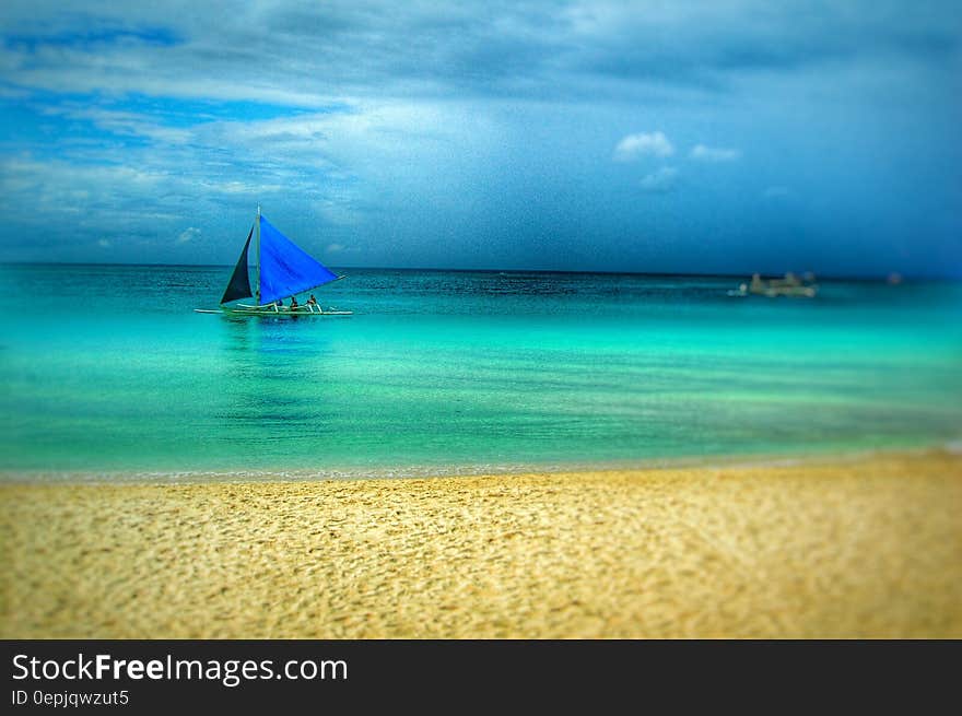 Painting of Blue Boat on Beach