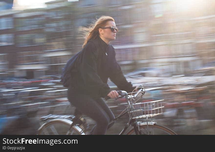 Woman Riding Bicycle