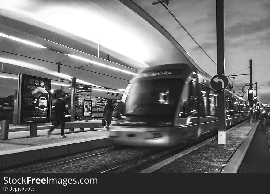 Grayscale Photography of People Near Train