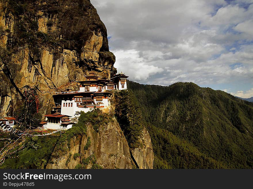 White Painted House on Top of the Mountain during Daytime