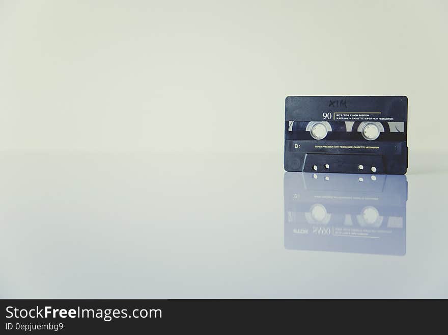 Black Cassette Tape Standing on White Surface