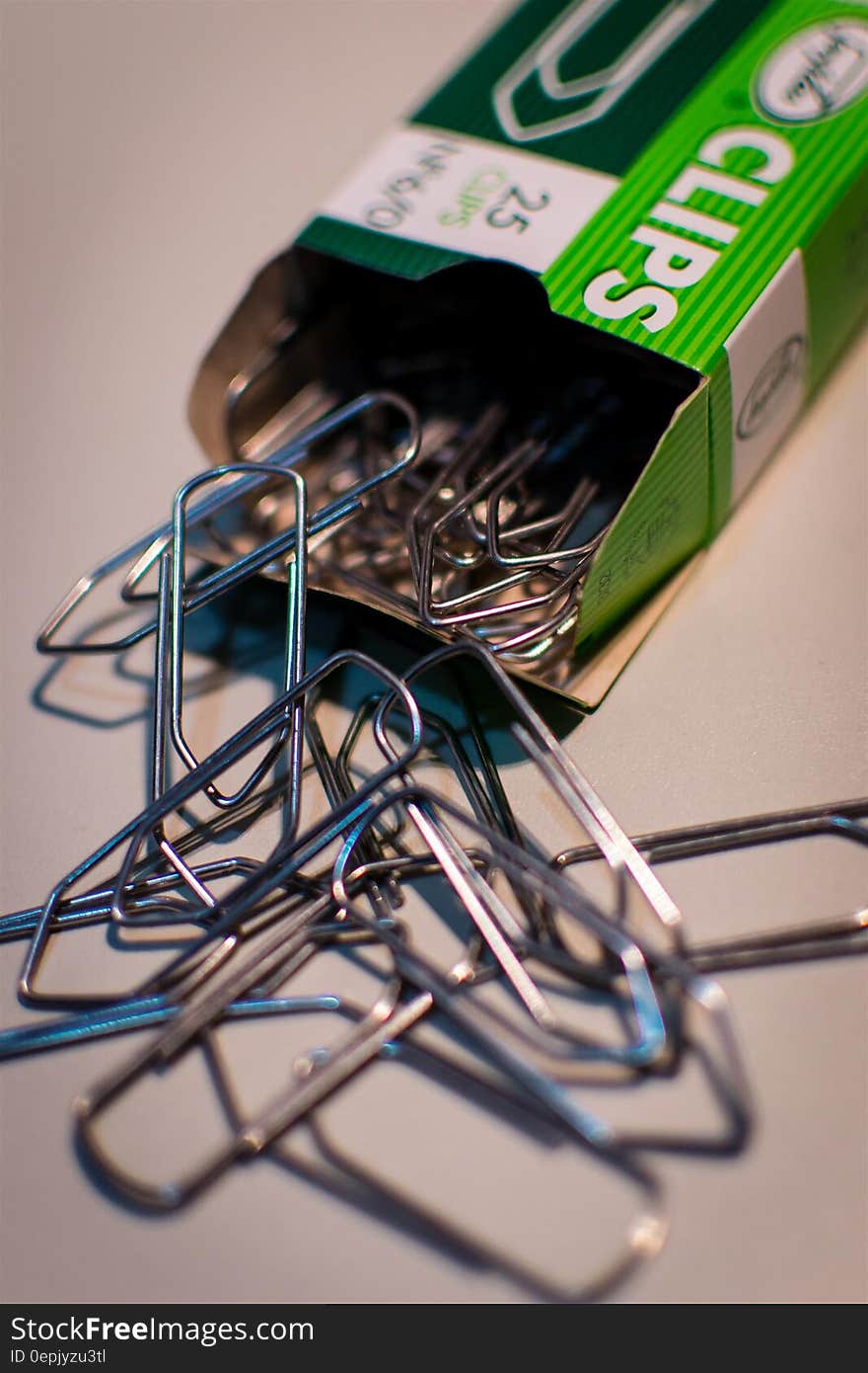 Stainless Steel Clips on White Table