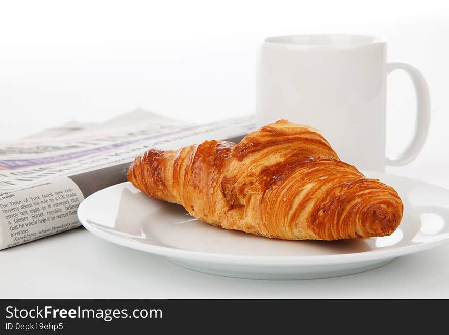 Crossant Bread on White Ceramic Plate