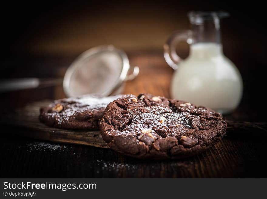 Brown Cookie Chips Near Clear Glass Jar With White Liquid