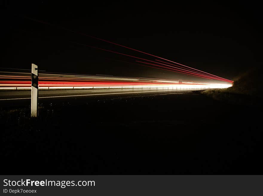 Night Photo of Car Lights on Bridge