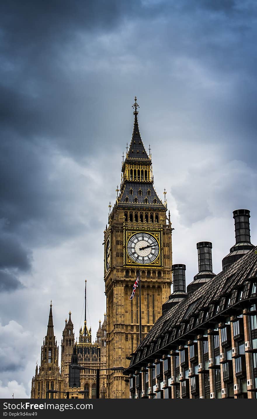 Big Ben clock tower on London Parliament building against blue cloudy skies, England. Big Ben clock tower on London Parliament building against blue cloudy skies, England.