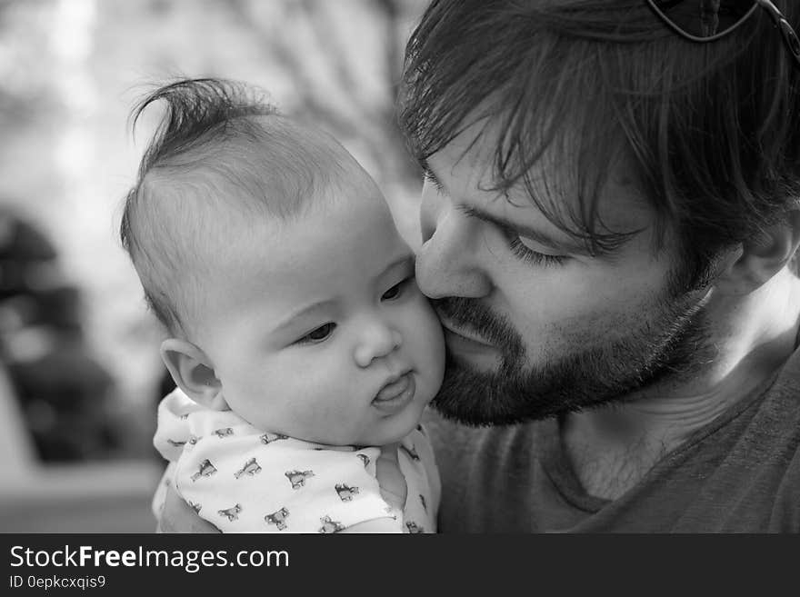 Portrait of father and child outdoors in black and white. Portrait of father and child outdoors in black and white.