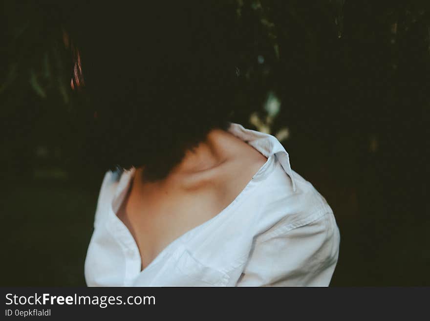 Woman in White V-neck Shirt