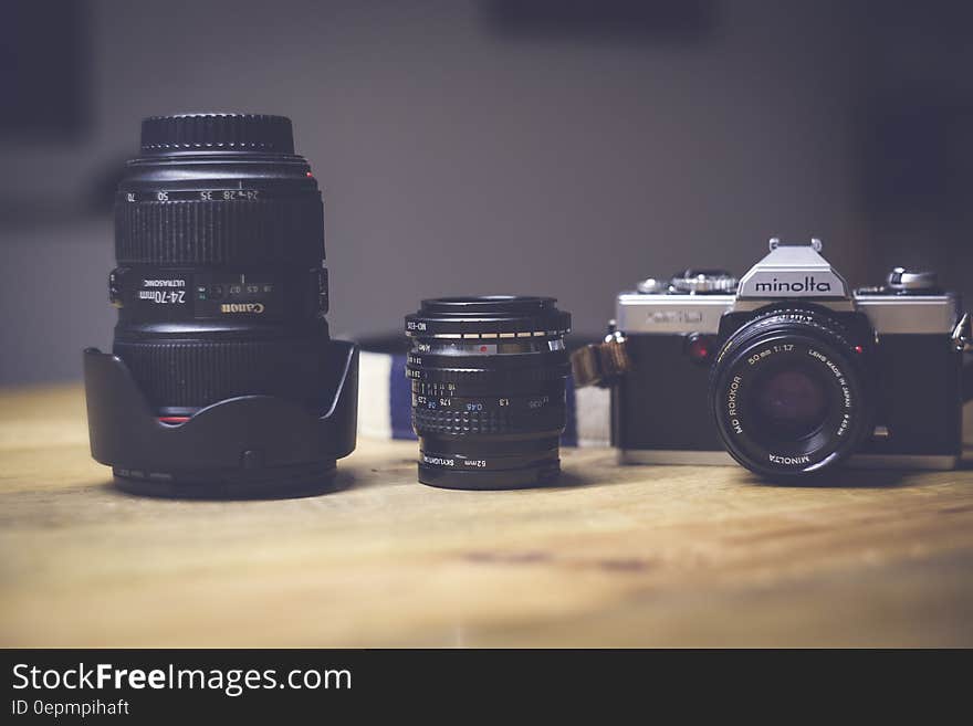 Black and White Dslr Camera Lens Beside Black Lens