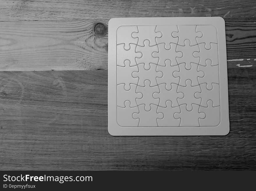 Gray Scale Photo of Jigsaw Puzzle