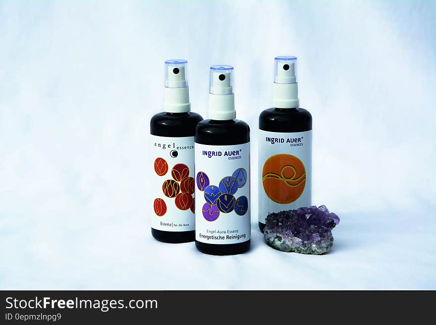 3 Spray Bottles Near Purple Geode