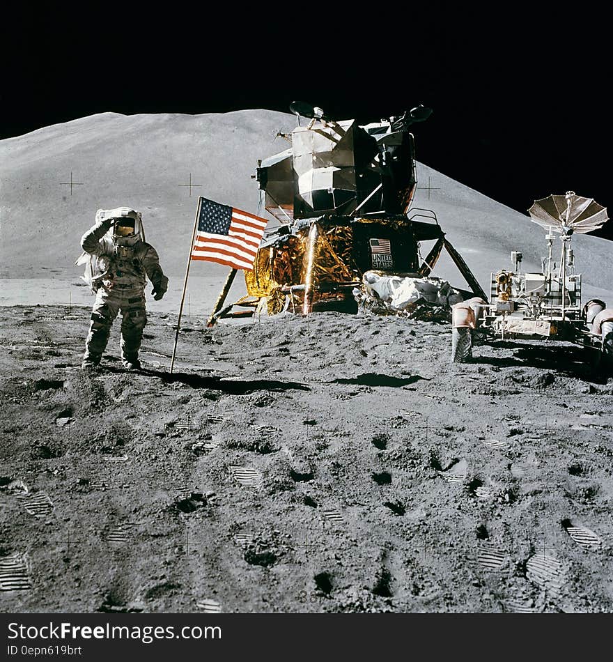 Astronaut Standing Beside American Flag on the Moon