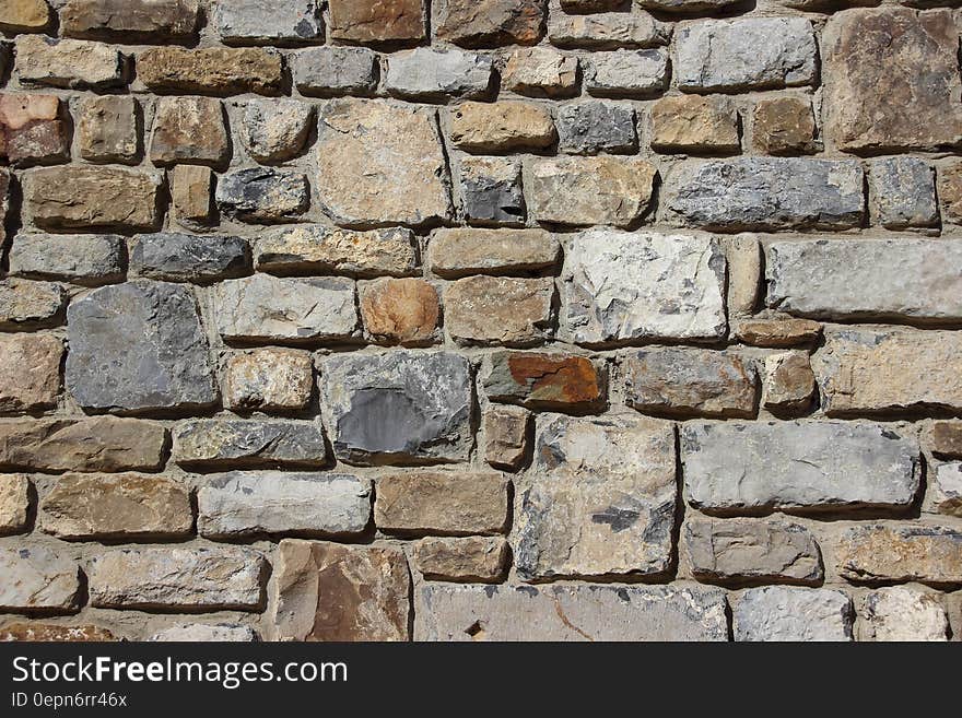 Gray Brown and Black Brick Stone Wall