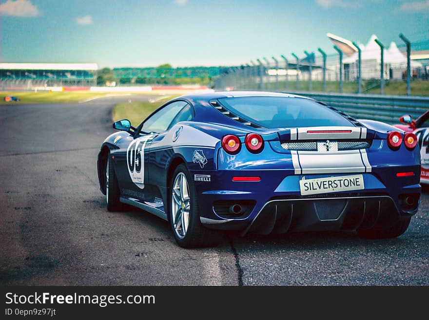 Silverstone Blue Silver Stripe Race Car on Track