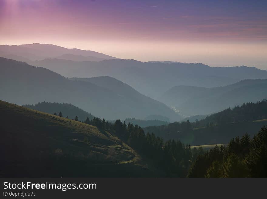 Sunset over a hazy mountain range. Sunset over a hazy mountain range.