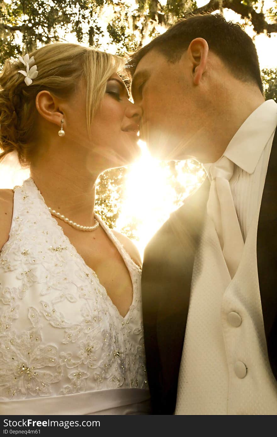 Man and Woman Kissing during Daytime